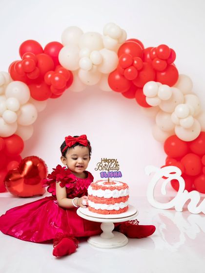 A happy smile as she enjoys her first birthday cake. I focus on capturing these expressions of pure joy.