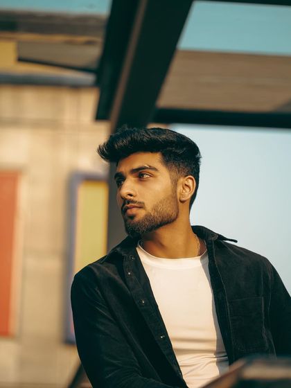 We used the warm tones of the late afternoon sun to create this atmospheric portrait. The colorful background is softly blurred, keeping the focus on the model's profile.