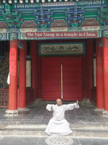 Practicing a low horse stance at the entrance of a temple in China. The architecture and atmosphere of these ancient grounds are a powerful reminder of our art's history.