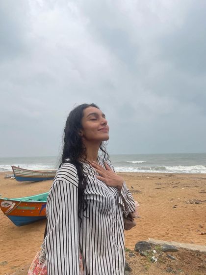 A moment of gratitude on the beach. This image is paired with my reflections and learnings from Sadguru, covering topics like acceptance, freedom, and suffering.