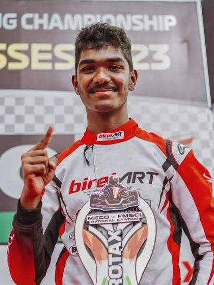 A close-up of our driver Abhay, celebrating his number one position after a commanding performance in the 2023 National Karting Championship.