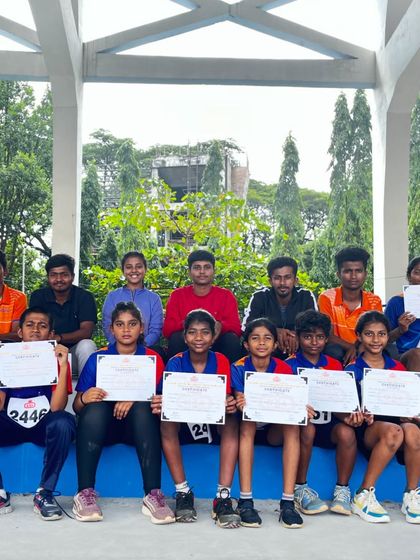 The full contingent of our young athletes and coaches at the Kanteerava Stadium athletics meet.
