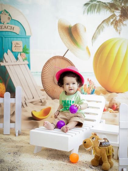 A day at the beach, no matter the weather. This sunny beach setup with a lounge chair and sand is perfect for a fun, summery vibe.