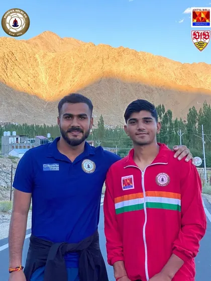 A coach with his arm around a young player in Ladakh. Our coaching philosophy is built on mentorship, guidance, and building strong, supportive relationships with our players.