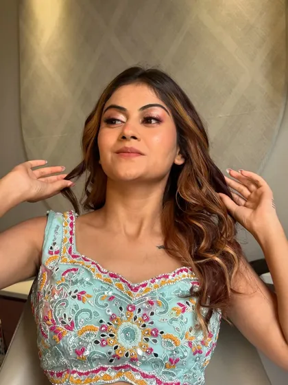 Another angle of this fun, desi-inspired look, showing how the hairstyle has movement and volume.