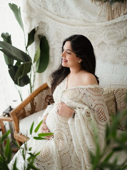 This image demonstrates a relaxed, seated pose that feels natural and candid. We'll work on directing clients into poses that are both flattering and comfortable.