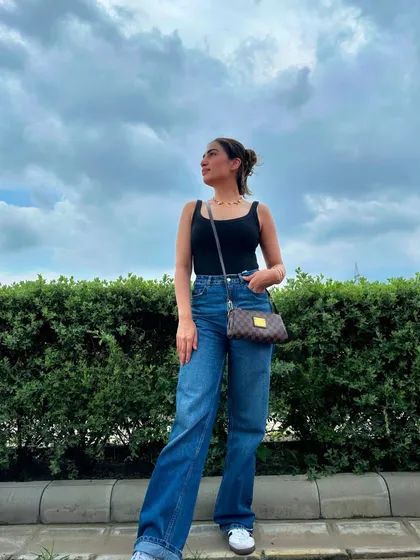 Another shot of the black tank and jeans combo, this time with my hair up in a bun for a more casual feel.