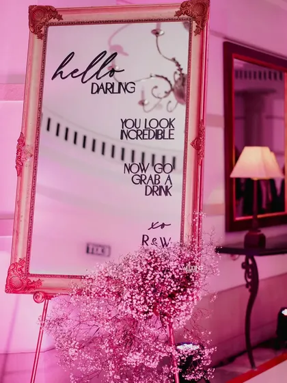 Another angle of the custom welcome mirror, reflecting the party's ambiance. These details help create a cohesive and immersive environment for your event.