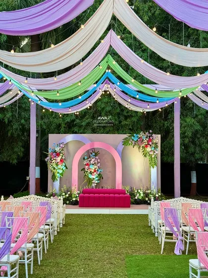 The complete pastel-themed setup, with the stage, aisle, and guest seating all beautifully coordinated.