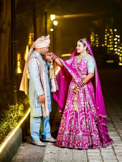 A sweet moment where the bride holds the groom's hand.