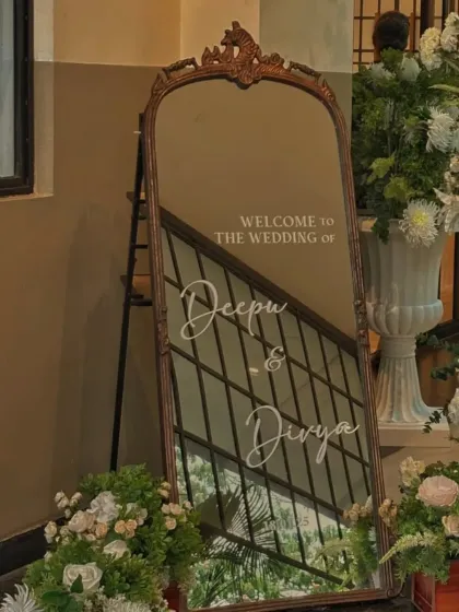 A personalized welcome mirror makes a beautiful first impression. For this wedding, I used an ornate vintage-style mirror with custom calligraphy to greet guests, setting a sophisticated and personal tone from the very beginning.