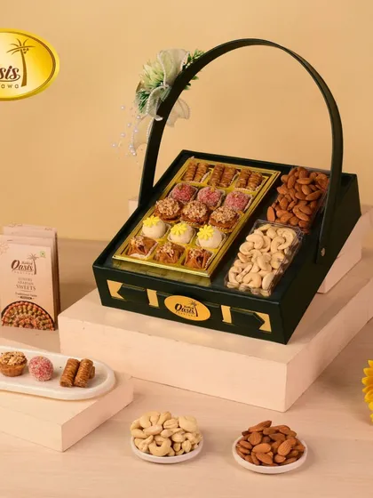 A deep green hamper that exudes elegance. It contains a curated selection of our most popular sweets alongside premium almonds and cashews.
