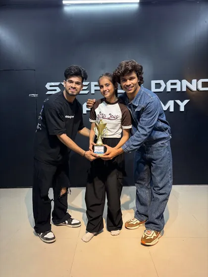 The smile of a winner. This student earned her trophy through consistent effort in our training batch.