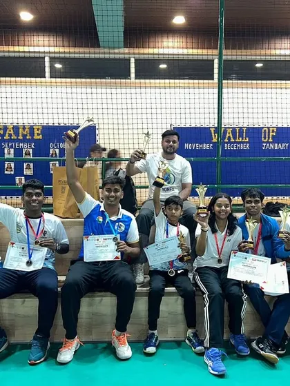 Our team celebrating their victories at the SHUTTLE FEST 4.0 tournament. We foster a supportive environment where every player's success is a team success.