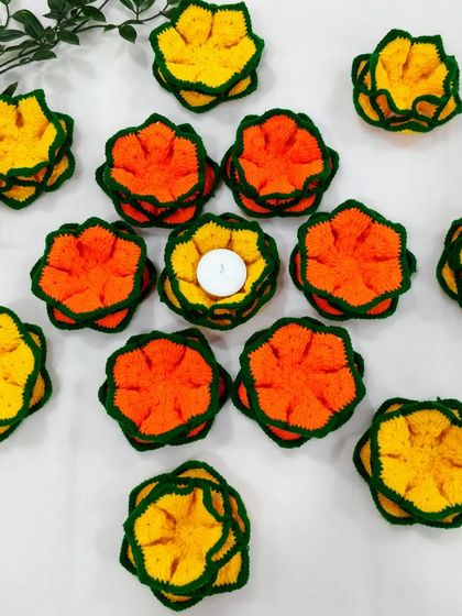 A playful arrangement of my orange and yellow lotus coasters, with a tea light placed in the center of one to show its versatility.