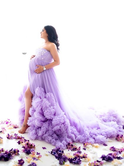 A full-length view of a dramatic ruffled gown against a clean white background. You'll learn how to make the outfit a central part of the story.