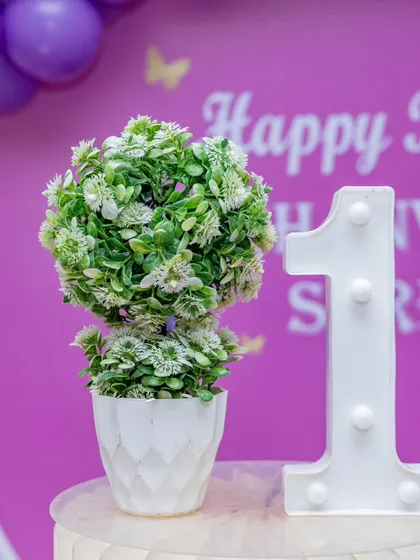 A close-up of the light-up number "1" prop. These are available for any age and add a nice glow to the decor.