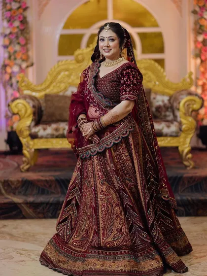 For brides who love a rich, royal look, this maroon velvet lehenga is a perfect choice. The detailed embroidery and luxurious fabric make it an unforgettable outfit for a winter wedding. Rent this designer piece for your big day.