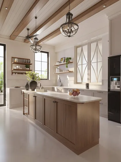 The kitchen is the heart of the home, a place for gathering. We designed this spacious kitchen around a large central island to serve as a hub for family life, using creamy white cabinetry, warm wood tones, and abundant natural light to make it feel open and inviting.