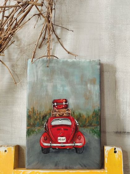 A duplicate of 19, our "Wanderlust on Wood" painting, styled in a rustic setting. The vintage red car is ready for the open road, inspiring a sense of freedom and adventure.
