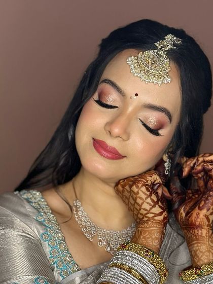 A close-up of this bride's reception makeup, with a focus on the shimmery eyes and her beautiful smile.