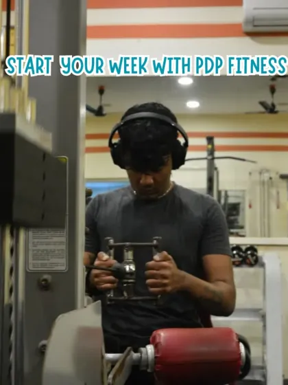 Get in the zone and start your week strong. A member using our cable machine for a focused back workout shows how our gym provides the right environment to tune out distractions and concentrate on your fitness goals.