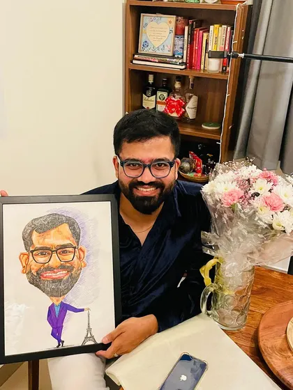 A happy client with his framed caricature. It’s always wonderful to see the final artwork ready to be gifted or displayed. These custom caricatures are a fun way to celebrate someone's personality and interests.