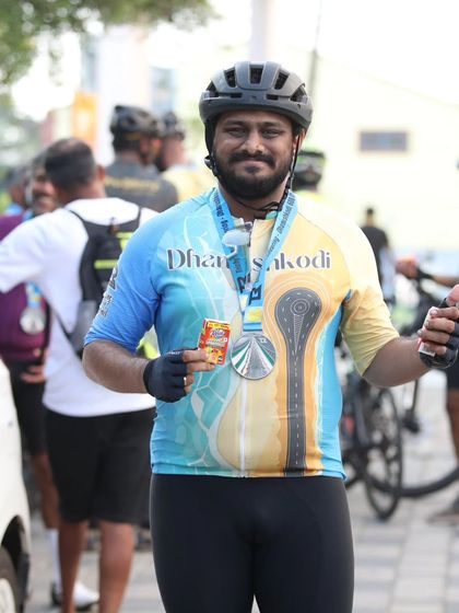 A finisher proudly displaying his medal after the Dhanushkodi 600 BRM. These medals are a symbol of the hard work, sweat, and perseverance that goes into every ultra endurance ride.