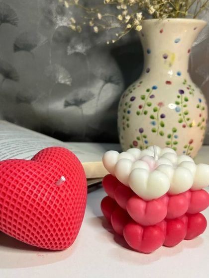 A closer look at our two signature heart designs together. The textured heart candle and the ombre heart bubble candle are both crafted to be beautiful decorative pieces that create a romantic ambiance.