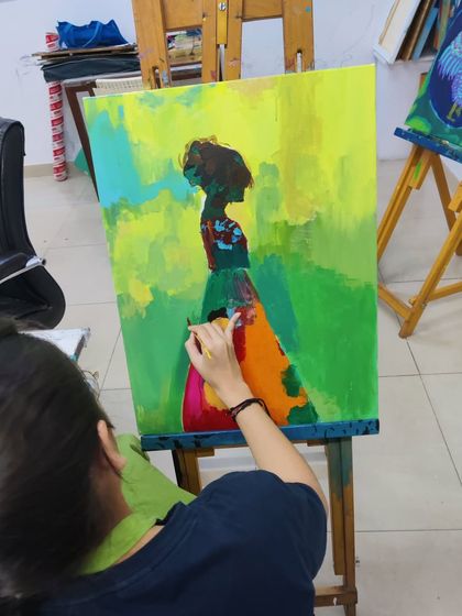 The creation of a colorful, abstract silhouette painting, showing the process of layering bright acrylics to create a stunning final piece.