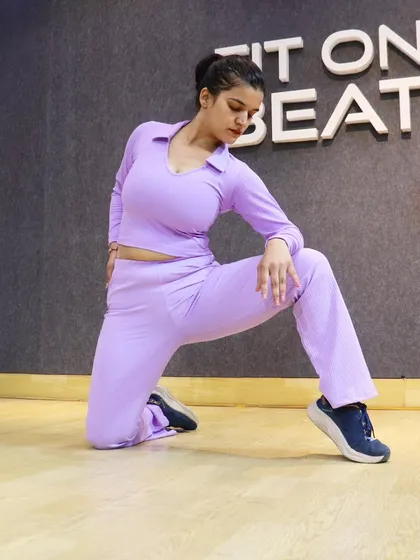 Taking a moment in a low lunge pose. This is a great stretch for the hip flexors, which can get tight from sitting. I incorporate dynamic stretches like this into our warmups to prepare the body for movement.