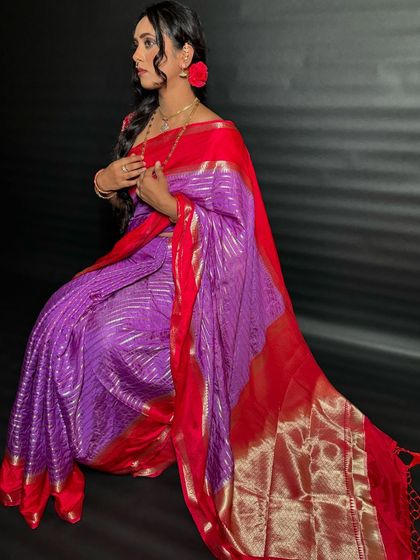 A simple side braid with a red flower, perfect for a traditional yet understated look. This style is great for a puja or family function.