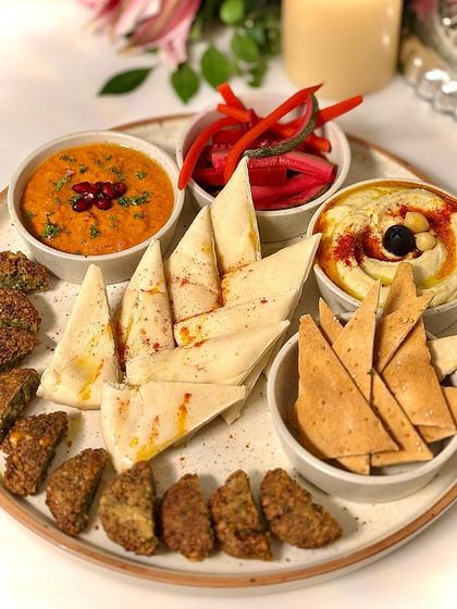 Another look at our vibrant mezze platter, complete with crispy falafel and a flavourful muhammara dip.