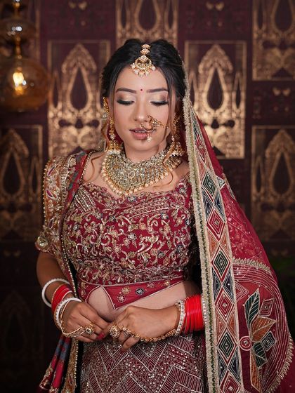 A full view of this stunning maroon bridal lehenga with intricate patterns. This is a perfect example of the soft bridal glam look many of my clients love.