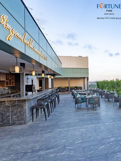 The full expanse of the Nakshatra rooftop bar and dining area, showcasing its modern architecture and open, airy design.