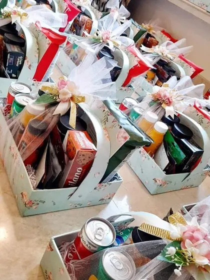 Another style of wedding welcome hampers, packed in beautiful floral boxes and wrapped in tulle, ready to greet guests and make them feel special.