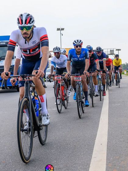 An elite rider, leading the peloton in a long and grueling race.