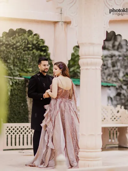 An intimate pre-wedding portrait framed by the elegant arches of the venue. We use architectural elements to create beautifully composed and romantic shots.