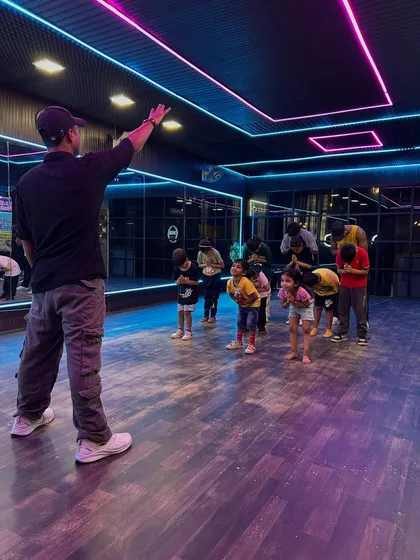 This is the heart of our studio: teaching with dedication and respect. As a guru, I guide my students, helping them find discipline and joy in every step.