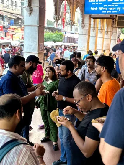 A diverse group gathers to sample local delicacies. Our tours are a great way to meet people from all over the world and connect over a shared love for food and exploration.