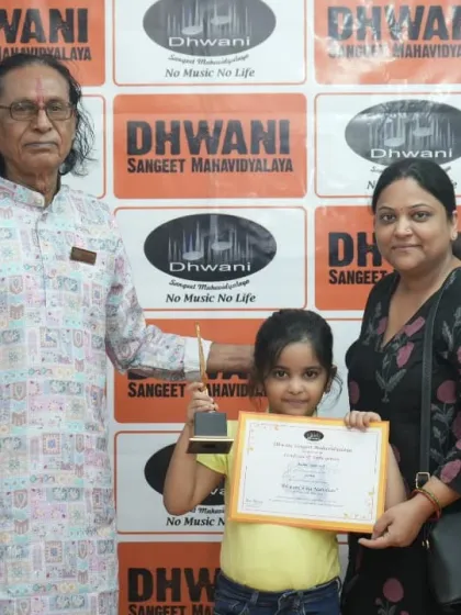 A student, her mother, and our senior guru at the prize distribution.