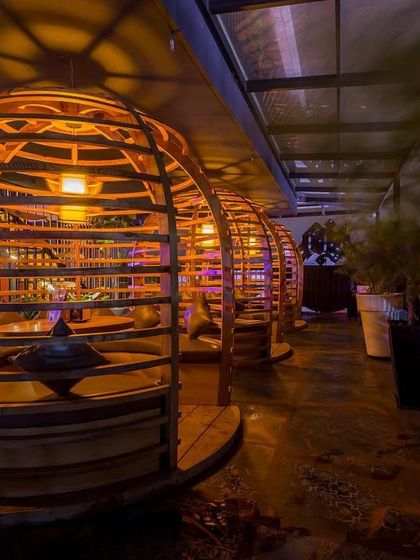 Another shot of our signature booth seating, showing how the slatted wood structure creates a sense of enclosure while still feeling connected to the surrounding environment.