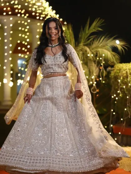 Shine bright at any celebration in this sparkling silver lehenga. It's a modern and glamorous choice for guests or for your own engagement party.