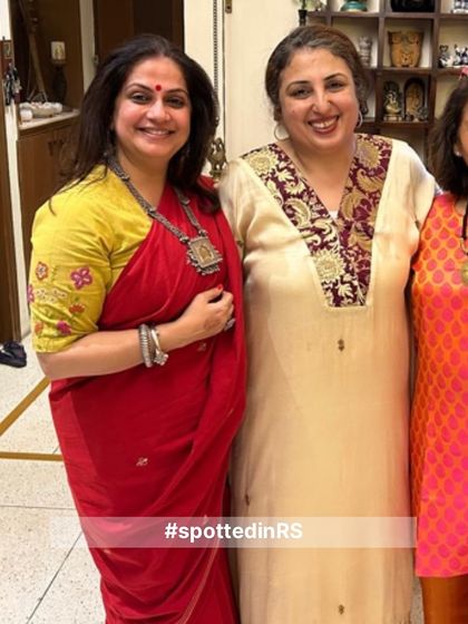 A customer looking stunning in a red saree with an embroidered blouse from Rangsutra. We love seeing how our family styles our pieces to create their own unique looks.
