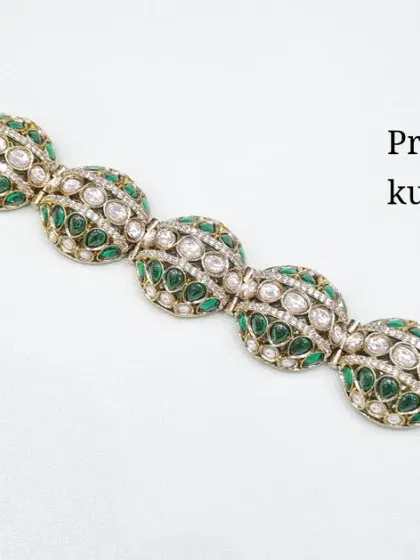 The same premium quality Kundan bracelet, shown here with emerald green accents. This adds a beautiful pop of color to the intricate design.