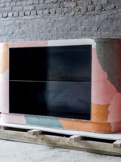 Our custom-made multi-color bar table, featuring a unique leaf imprint on the side. This piece combines playful color blocking with subtle natural texture, creating a functional bar that is also a piece of art.