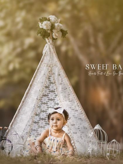 A sweet baby girl, hearts full of love. A calm and serene portrait of a baby in our outdoor teepee.