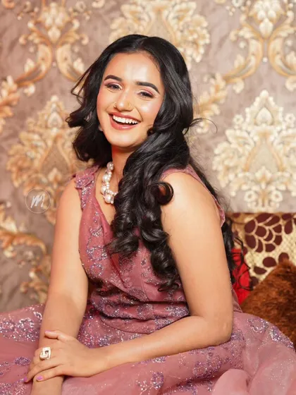 A joyful, laughing shot that shows the makeup looks natural and not heavy.