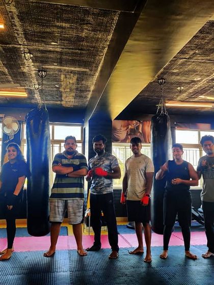 The team posing after class. We make sure to follow all safety guidelines while still getting in a great workout together.