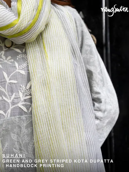 The Suhani green and grey striped Kota dupatta, paired here with a Chikankari kurta. The combination of crafts and textures creates a look that is rich in heritage and style.